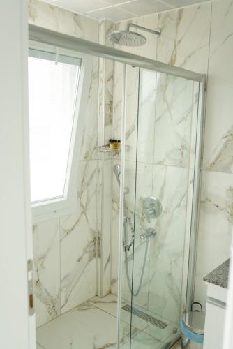 a shower with a glass door in a bathroom at Blue Island Luxury Hotel Adults Only in Kaş