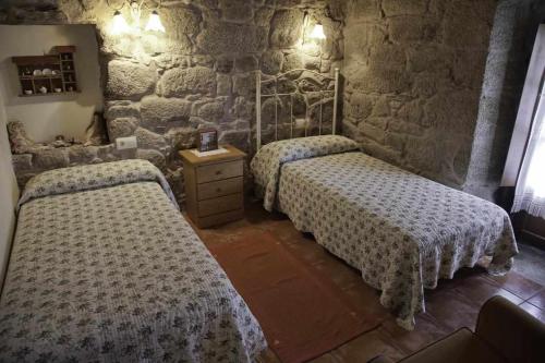 Casa Rural A Cobacha tesisinde bir odada yatak veya yataklar