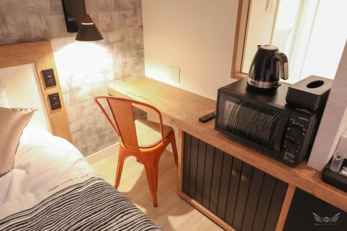 Un ou plusieurs lits dans un hébergement de l'établissement FFFFFF Hotel エフホテル
