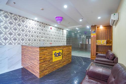 a lobby with a reception desk in a building at FabHotel HC Mohali Inn in Kharar