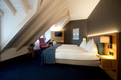 Hotel-Restaurant Löwen tesisinde bir odada yatak veya yataklar
