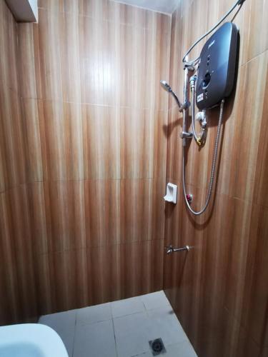 a bathroom with a shower and a toilet at BAGUIO Betty's Room Rental Couple Studio in Baguio