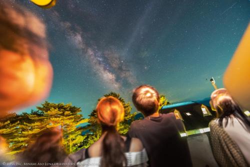 a group of people looking up at the night sky at Minami Aso Luna Observatory Auberge Mori no Atelier in Minami Aso