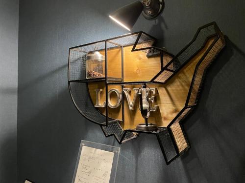 a shelf with a mirror on the wall at Hotel LOVE JEWEL in Kitakyushu
