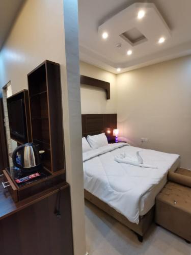 Postel nebo postele na pokoji v ubytování Nice View Hotel فندق الأطلالة الجميلة للعائلات فقط