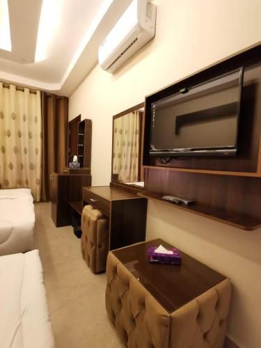 Postel nebo postele na pokoji v ubytování Nice View Hotel فندق الأطلالة الجميلة للعائلات فقط