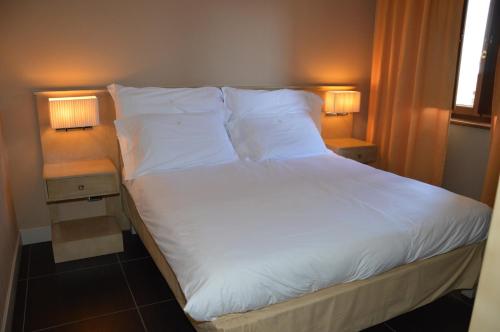 Katil atau katil-katil dalam bilik di Roccamonfina Palace Hotel