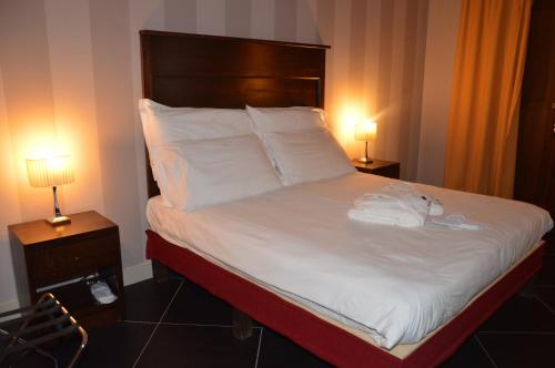 Katil atau katil-katil dalam bilik di Roccamonfina Palace Hotel
