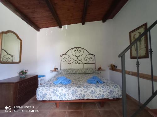 Кровать или кровати в номере La Casa dei Daini
