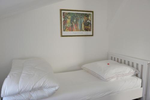 Un pat sau paturi într-o cameră la Wohnung Steuerbord