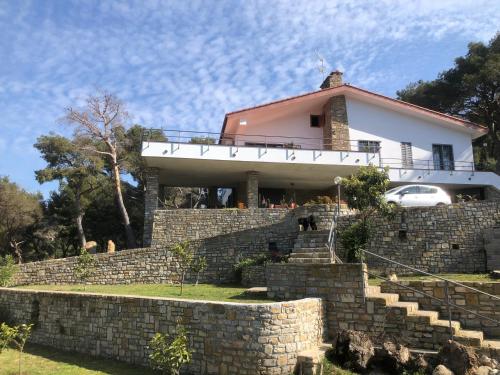 a house on top of a stone wall at Il Lampin B&B in Marina di Andora
