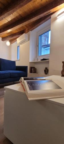 a living room with a couch and a table at Sarpi21 Suites in Udine