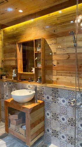 a bathroom with a sink and a shower at Lem Homestay Đà Lạt in Da Lat