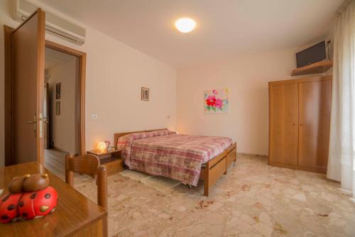 a bedroom with a bed and a table in a room at Hotel Santa Maria in Assisi