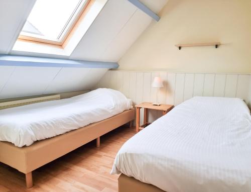 Postel nebo postele na pokoji v ubytování Vakantiehuis Domburg, kindvriendelijk DO02
