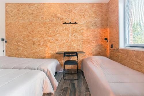Postel nebo postele na pokoji v ubytování Le Dortoir des Templiers