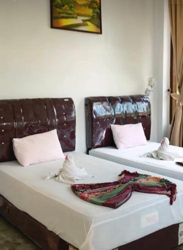 Ένα ή περισσότερα κρεβάτια σε δωμάτιο στο JungleRiverHouse & JungleRiverResort
