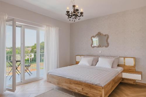 En eller flere senge i et værelse på Villa Mokka - Perfekt ausgestattete Villa in hervorragender Lage