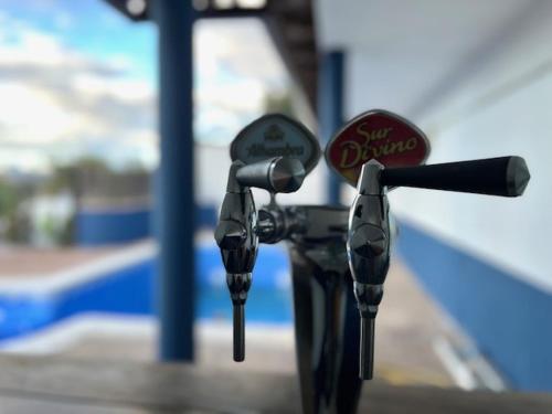 a pair of parking meters in a gas station at Paradise in Aldea del Fresno