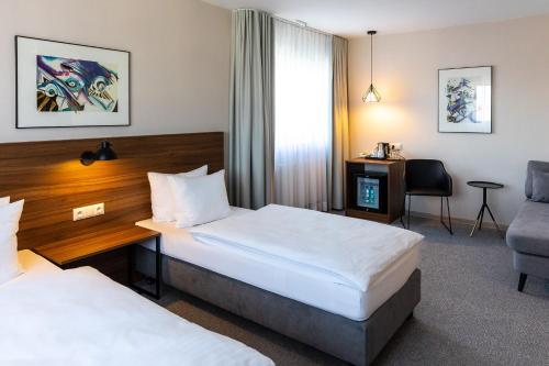Voodi või voodid majutusasutuse Hotel Santin toas
