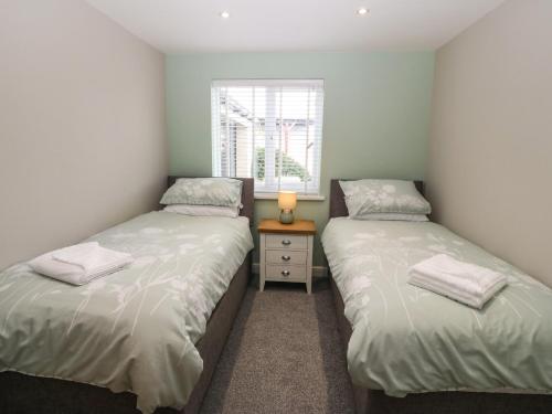 Ένα ή περισσότερα κρεβάτια σε δωμάτιο στο Bryn Derw