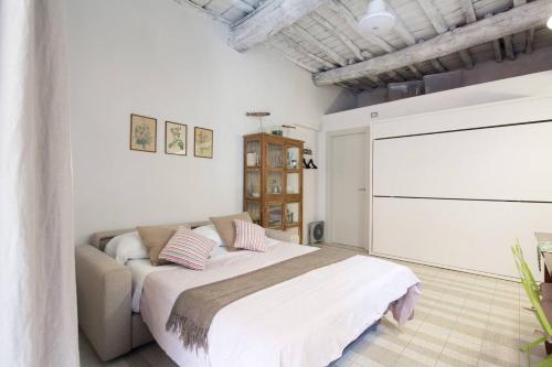 a bedroom with a bed and a television in it at Albarola in Monterosso al Mare