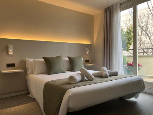 Un pat sau paturi într-o cameră la AZ Hotel San Valero