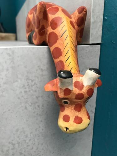a figurine of a giraffe hanging on a door at Amarillo Guesthouse in Bournemouth
