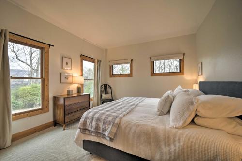a bedroom with a bed and a dresser and a window at Sapphire Retreat with Views, Fire Pit, and Lake Access in Sapphire