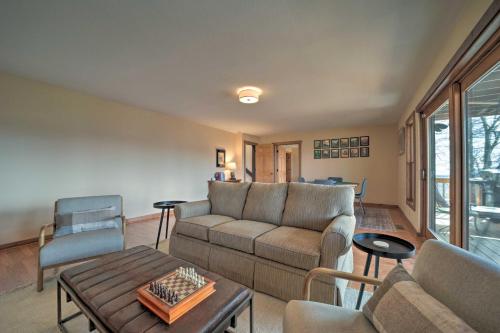 a living room with a couch and a table at Sapphire Retreat with Views, Fire Pit, and Lake Access in Sapphire