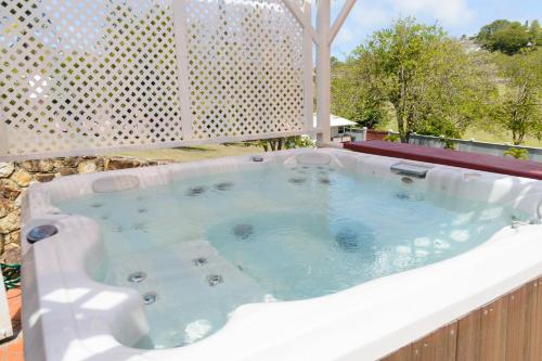 a large hot tub sitting on top of a building at Sephina Villa St Lucia Island Dream Holidays in Cap Estate