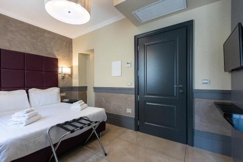 Un ou plusieurs lits dans un hébergement de l'établissement Hotel Castellino Roma