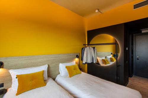 Una cama o camas en una habitación de Ibis Styles Roma Aurelia