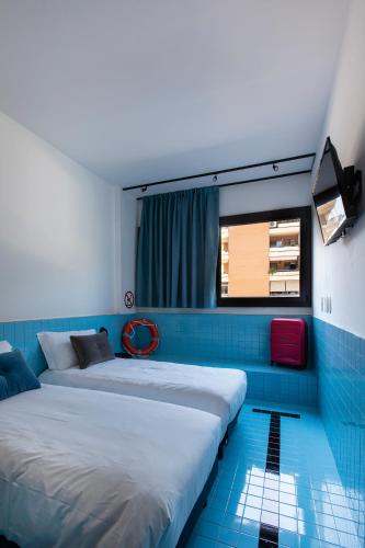 Una cama o camas en una habitación de Ibis Styles Roma Aurelia