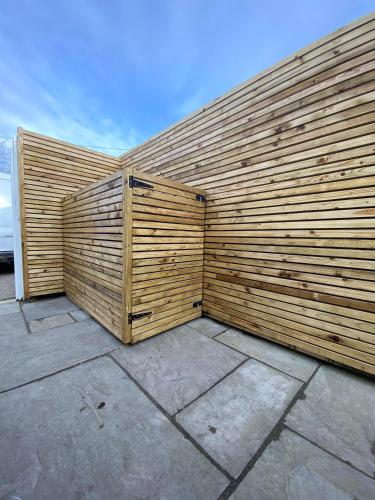 a wooden retaining wall with a wooden fence at 4 Sea View Walk, Pakefield in Pakefield