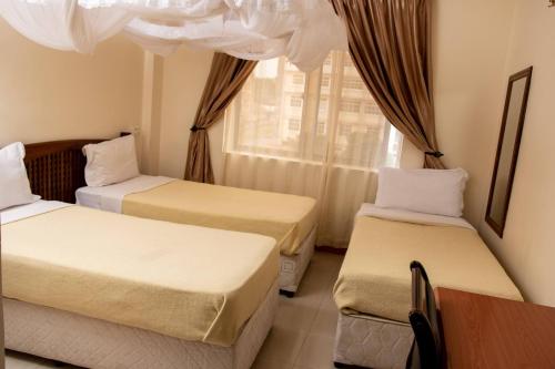 Krevet ili kreveti u jedinici u objektu Briston Hotel