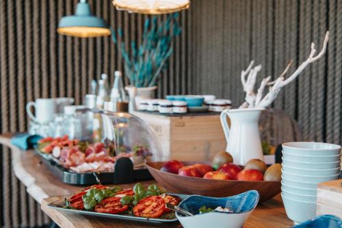 a buffet with plates of food on a table at Hafenmeisterei in Steinhude