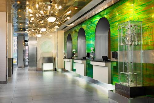 a hallway with a green and colorful wall at OYO Times Square in New York