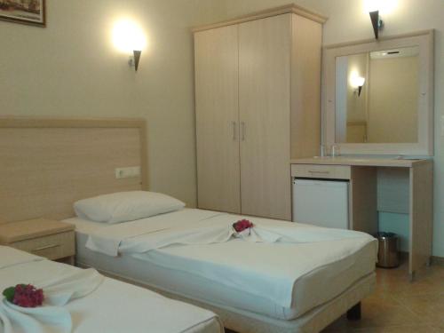 Katil atau katil-katil dalam bilik di Kaunos Hotel