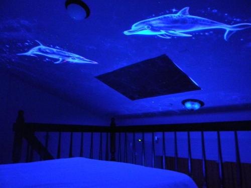 Una cama o camas en una habitación de Miaoli Sanyi Bo Wu Guan Homestay