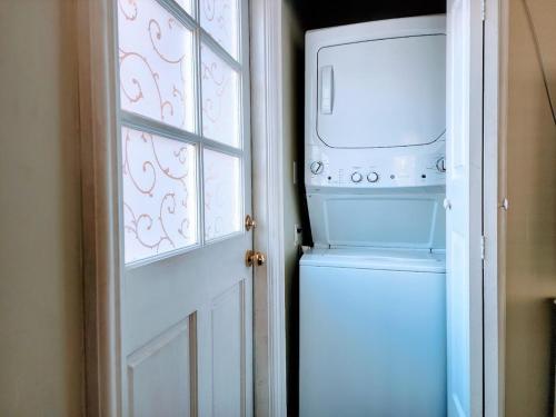 a washer and dryer sitting next to a door at 628 Madre Street in Pasadena