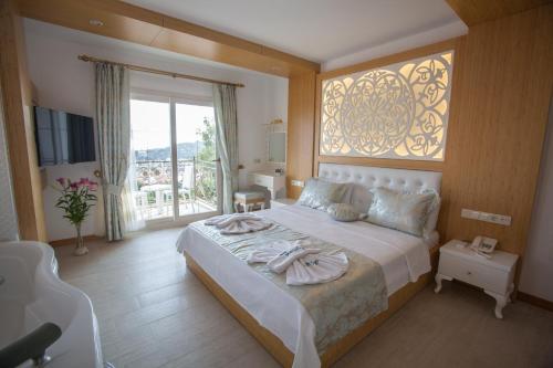 Postel nebo postele na pokoji v ubytování Hotel Aysima