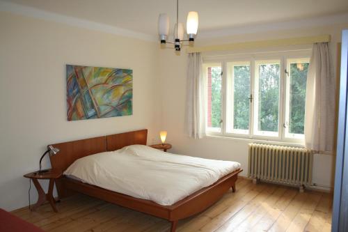 Postel nebo postele na pokoji v ubytování Familiehuis Fuchs