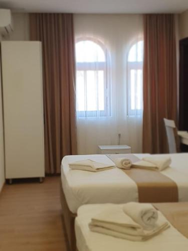 Postel nebo postele na pokoji v ubytování Hotel Camp Karagaq