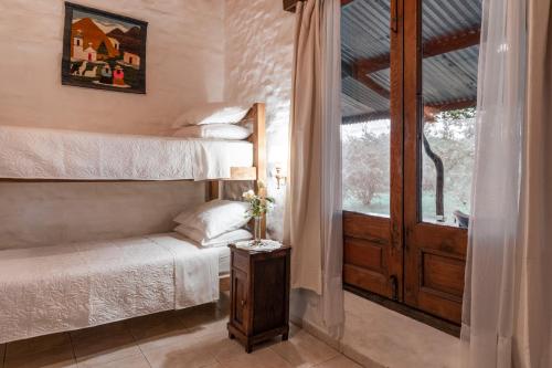 Tempat tidur susun dalam kamar di La Casa del Bosque Carmelo