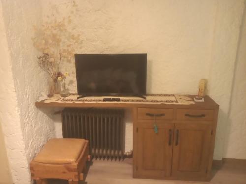 a laptop computer sitting on top of a wooden desk at La Generosa in San Carlos de Bariloche