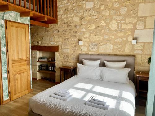 Postel nebo postele na pokoji v ubytování La Gomerie Chambres d'Hotes