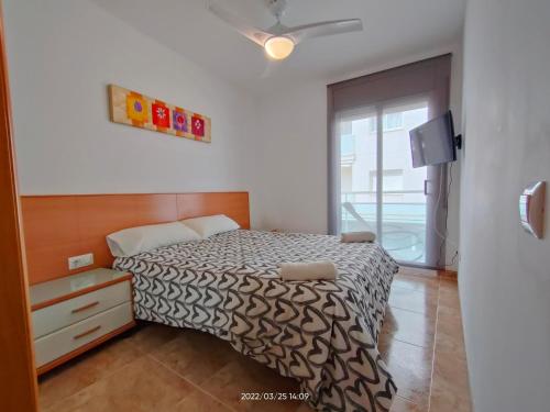 Ένα ή περισσότερα κρεβάτια σε δωμάτιο στο LG Calafell Beach