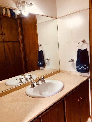 a bathroom counter with a sink and a mirror at Descanso y Experiencias en Chacras de Coria in Ciudad Lujan de Cuyo