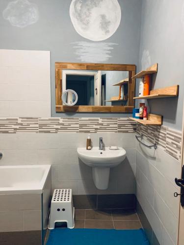 a bathroom with a sink and a mirror at Appartamento SoloSoleMare in Portovenere